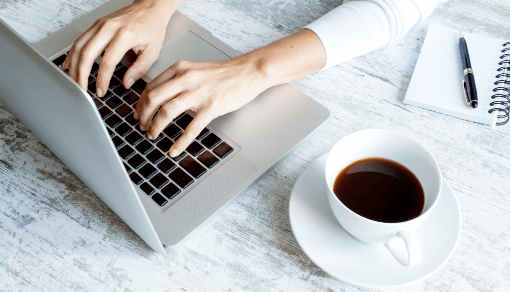 Lady working on a computer doing marketing and social media work.